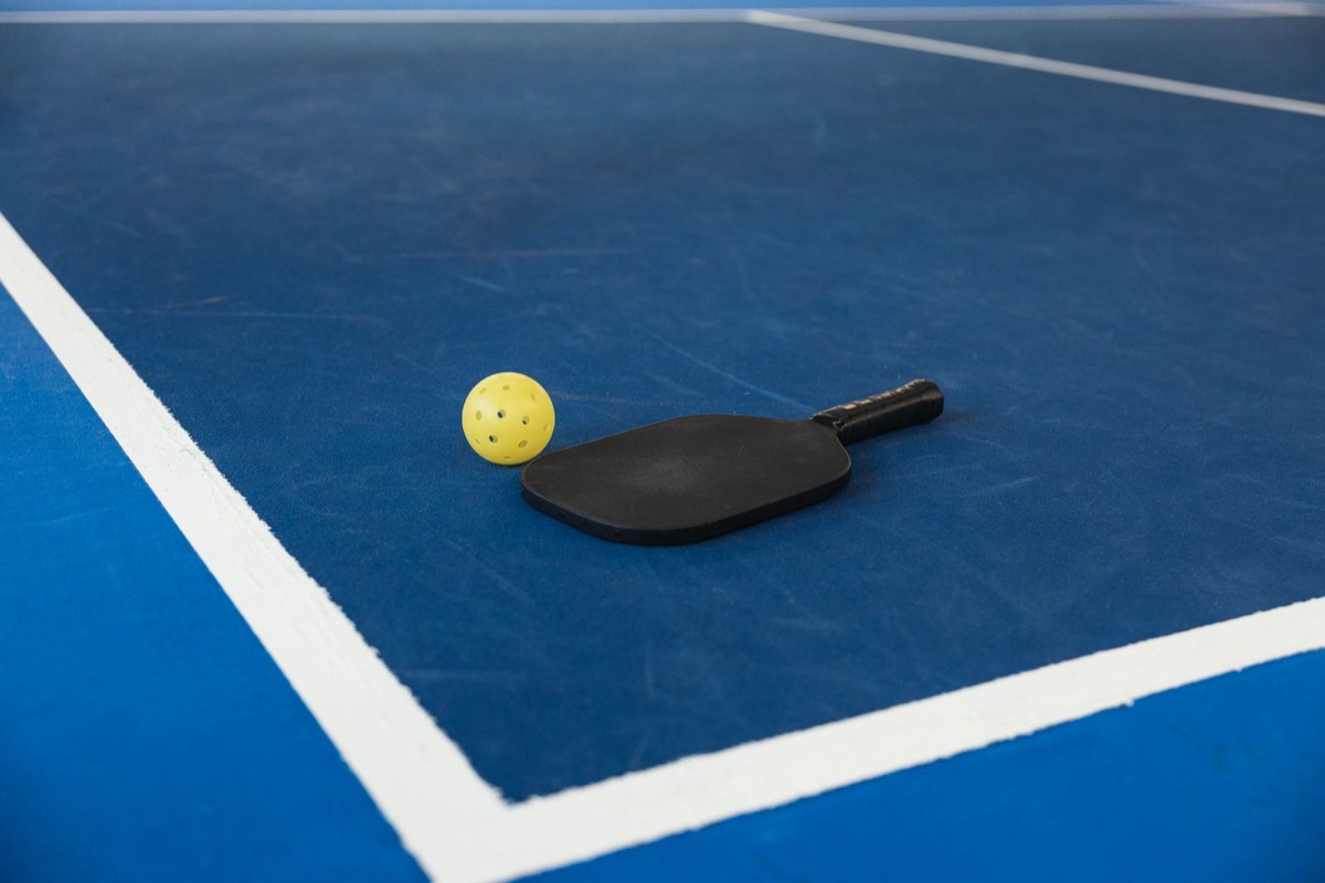 Pickleball court with net and painted lines